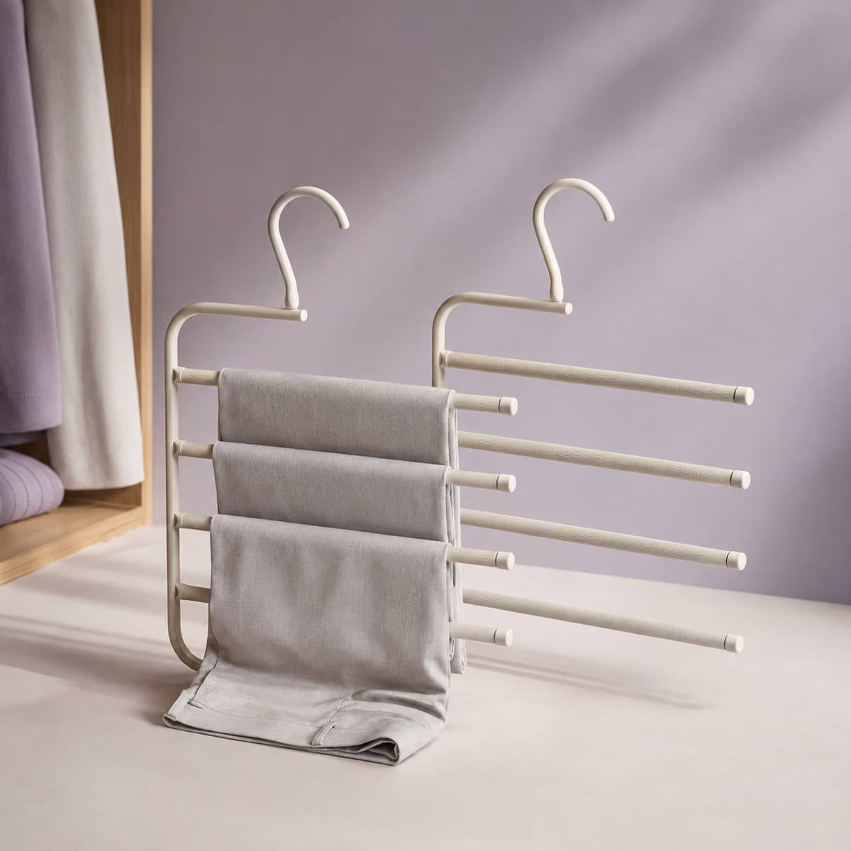 Multi-Tier Trouser Hanger Duo — Eight pairs of trousers in the space of two, without a crease across the knee.