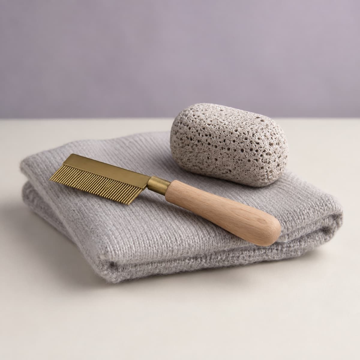 Cashmere Comb & Sweater Stone Duo — The gentle pair for fine knitwear that a shaver would be too blunt for.